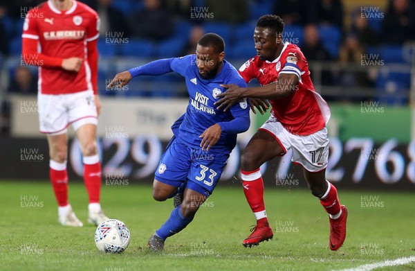 060318 - Cardiff City v Barnsley - SkyBet Championship - Junior Hoilett of Cardiff City is challenged by Andy Yiadom of Barnsley