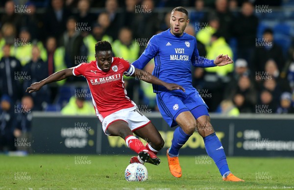 060318 - Cardiff City v Barnsley - SkyBet Championship - Andy Yiadom of Barnsley is challenged by Kenneth Zohore of Cardiff City