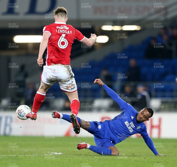 060318 - Cardiff City v Barnsley - SkyBet Championship - Liam Lindsay of Barnsley is tackled by Loic Damour of Cardiff City