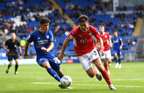 070821 - Cardiff City v Barnsley - Sky Bet EFL Championship - Liam Kitching of Barnsley competes with Ryan Giles of Cardiff City