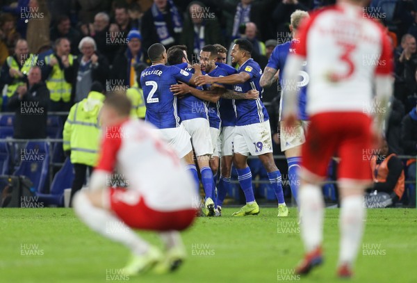 071219 - Cardiff City v Barnsley, Sky Bet Championship - Cardiff City players celebrate with Lee Tomlin who scored the winning goal in added time