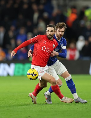 270126 - Cardiff City v Barnsley, EFL Sky Bet League 1 - Adam Phillips of Barnsley holds off Calum Chambers of Cardiff City