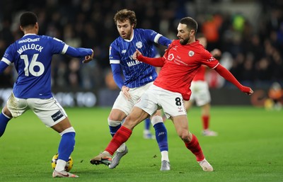 270126 - Cardiff City v Barnsley, EFL Sky Bet League 1 - Adam Phillips of Barnsley holds off Calum Chambers of Cardiff City