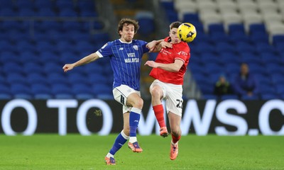 270126 - Cardiff City v Barnsley, EFL Sky Bet League 1 - Ryan Wintle of Cardiff City and Patrick Kelly of Barnsley compete for the ball