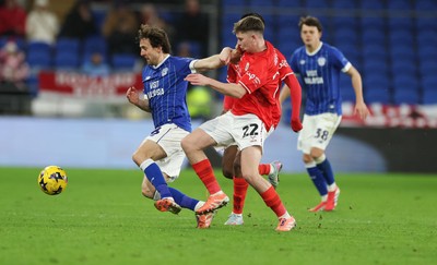 270126 - Cardiff City v Barnsley, EFL Sky Bet League 1 - Ryan Wintle of Cardiff City gets away from Patrick Kelly of Barnsley