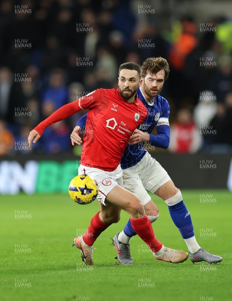 270126 - Cardiff City v Barnsley, EFL Sky Bet League 1 - Adam Phillips of Barnsley holds off Calum Chambers of Cardiff City