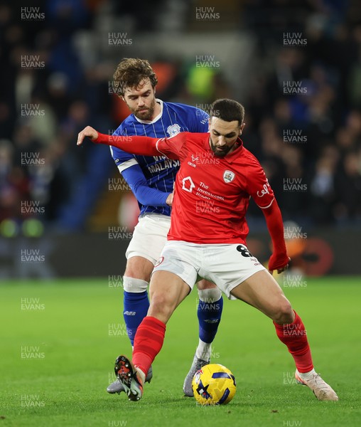 270126 - Cardiff City v Barnsley, EFL Sky Bet League 1 - Adam Phillips of Barnsley holds off Calum Chambers of Cardiff City