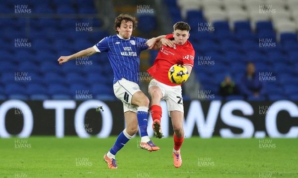 270126 - Cardiff City v Barnsley, EFL Sky Bet League 1 - Ryan Wintle of Cardiff City and Patrick Kelly of Barnsley compete for the ball