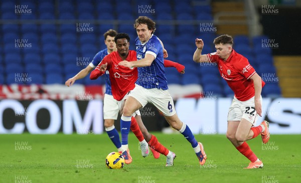 270126 - Cardiff City v Barnsley, EFL Sky Bet League 1 - Ryan Wintle of Cardiff City gets away from Patrick Kelly of Barnsley