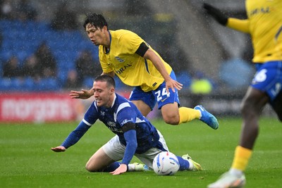 241026 - Cardiff City v Birmingham City - Sky Bet Championship - Jack Moylan of Cardiff City is challenged by Tomoki Iwata of Birmingham City
