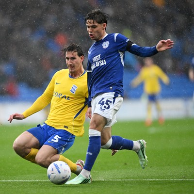 241026 - Cardiff City v Birmingham City - Sky Bet Championship - Cian Ashford of Cardiff City is challenged by Phil Neumann of Birmingham City