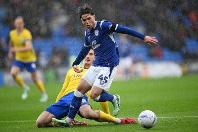 241026 - Cardiff City v Birmingham City - Sky Bet Championship - Cian Ashford of Cardiff City is challenged by Phil Neumann of Birmingham City