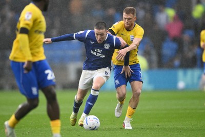 241026 - Cardiff City v Birmingham City - Sky Bet Championship - Jack Moylan of Cardiff City is challenged by Carlos Vicente of Birmingham City