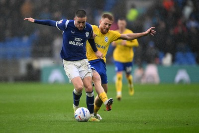 241026 - Cardiff City v Birmingham City - Sky Bet Championship - Jack Moylan of Cardiff City is challenged by Carlos Vicente of Birmingham City