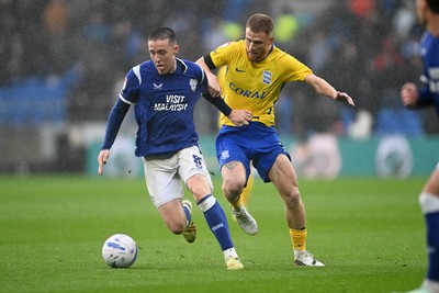 241026 - Cardiff City v Birmingham City - Sky Bet Championship - Jack Moylan of Cardiff City is challenged by Carlos Vicente of Birmingham City