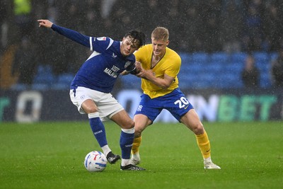 241026 - Cardiff City v Birmingham City - Sky Bet Championship - Perry NG of Cardiff City is challenged by Alex Cochrane of Birmingham City