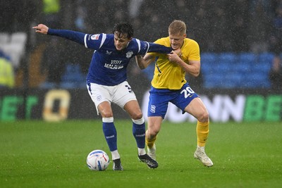 241026 - Cardiff City v Birmingham City - Sky Bet Championship - Perry NG of Cardiff City is challenged by Alex Cochrane of Birmingham City
