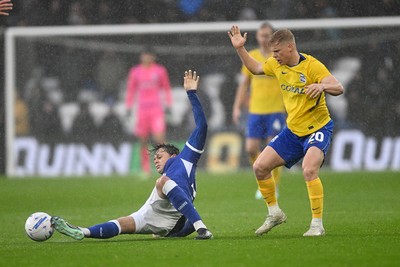 241026 - Cardiff City v Birmingham City - Sky Bet Championship - Perry NG of Cardiff City is challenged by Alex Cochrane of Birmingham City