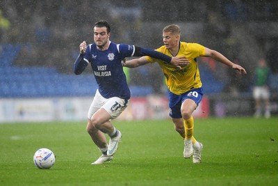 241026 - Cardiff City v Birmingham City - Sky Bet Championship - Ollie Tanner of Cardiff City is challenged by Alex Cochrane of Birmingham City