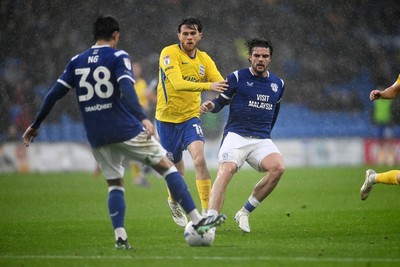 241026 - Cardiff City v Birmingham City - Sky Bet Championship - Ollie Tanner of Cardiff City is challenged by Scott Wright of Birmingham City