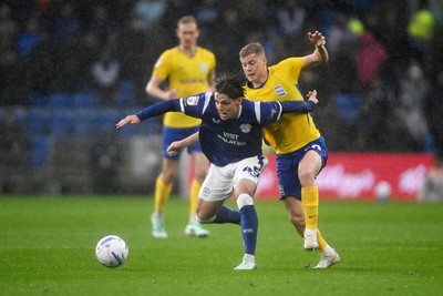 241026 - Cardiff City v Birmingham City - Sky Bet Championship - Cian Ashford of Cardiff City is challenged by Alex Cochrane of Birmingham City