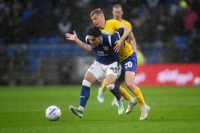 241026 - Cardiff City v Birmingham City - Sky Bet Championship - Cian Ashford of Cardiff City is challenged by Alex Cochrane of Birmingham City