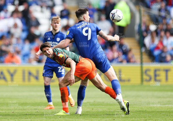 300422 - Cardiff City v Birmingham City, Sky Bet Championship - George Friend of Birmingham City and Jordan Hugill of Cardiff City compete for the ball