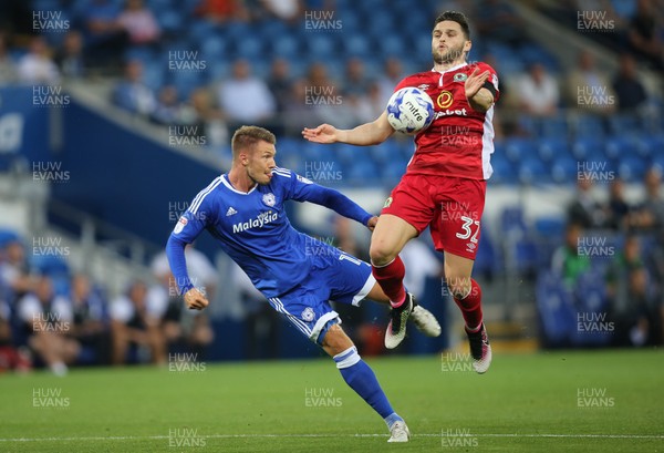 170816 - Cardiff City v Blackburn, Sky Bet Championship - Anthony Pilkington of Cardiff City and Craig Conway of Blackburn compete to win the ball