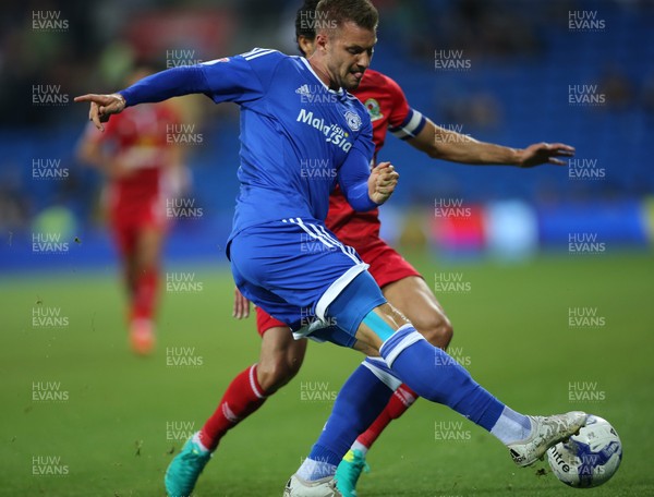 170816 - Cardiff City v Blackburn, Sky Bet Championship - Anthony Pilkington of Cardiff City and Jason Lowe of Blackburn compete to win the ball