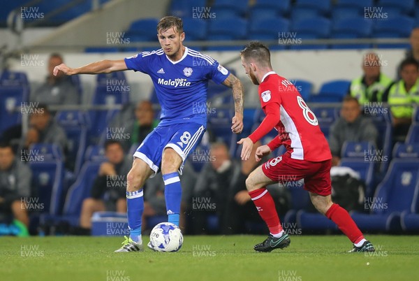 170816 - Cardiff City v Blackburn, Sky Bet Championship - Joe Ralls of Cardiff City plays the ball past Jack Byrne of Blackburn