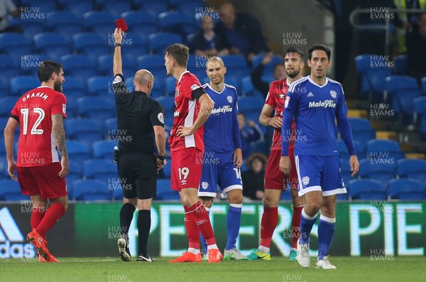 170816 - Cardiff City v Blackburn, Sky Bet Championship - Shane Duffy of Blackburn, second right, is shown a red card