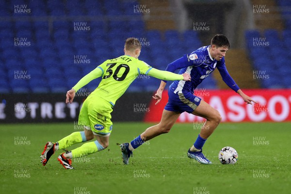 200224 - Cardiff City v Blackburn Rovers - SkyBet Championship - Rubin Colwill of Cardiff City is challenged by Jake Garrett of Blackburn 