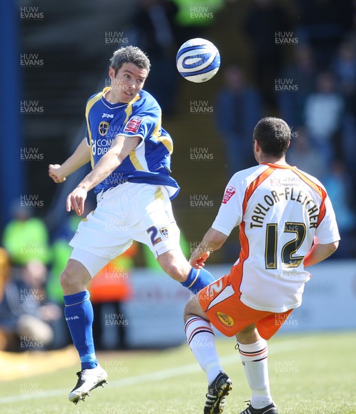 12.04.08 .. Cardiff City v Blackpool, Coca Cola Championship Cardiff's Kevin McNaughton heads the ball past Blackpool's Gary Taylor-Fletcher  