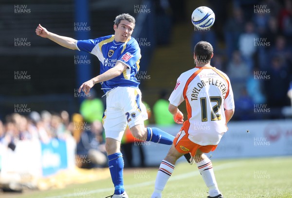 12.04.08 .. Cardiff City v Blackpool, Coca Cola Championship Cardiff's Kevin McNaughton heads the ball past Blackpool's Gary Taylor-Fletcher  