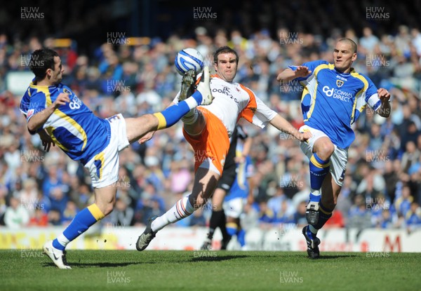 12.04.08 - Championship Football Cardiff City v Blackpool Blackpool's Ben Burgess  is challenged by Cardiff's Roger Johnson and Darren Purse 