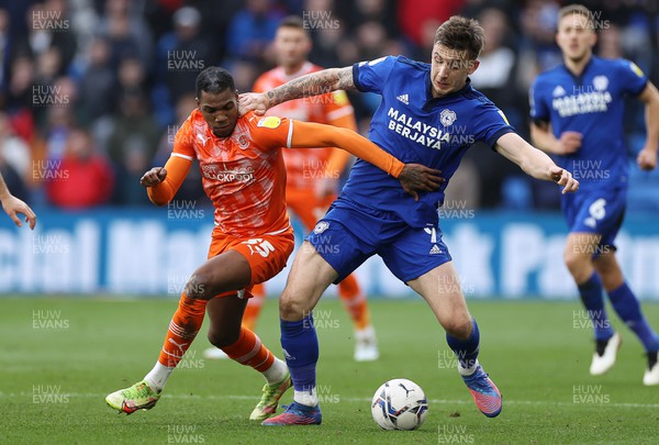 190222 - Cardiff City v Blackpool - SkyBet Championship - Jordan Hugill of Cardiff City is tackled by Dujon Sterling of Blackpool