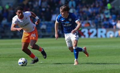 210326 - Cardiff City v Blackpool, EFL Sky Bet League 1 - Cian Ashford of Cardiff City takes on Reuell Walters of Blackpool