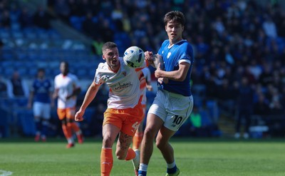210326 - Cardiff City v Blackpool, EFL Sky Bet League 1 - Rubin Colwill of Cardiff City and Olly Casey of Blackpool compete for the ball