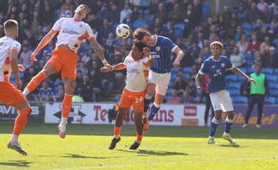 210326 - Cardiff City v Blackpool, EFL Sky Bet League 1 - Will Fish of Cardiff City and Reuell Walters of Blackpool compete for the ball infront of goal