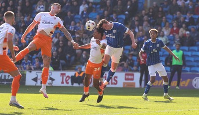 210326 - Cardiff City v Blackpool, EFL Sky Bet League 1 - Will Fish of Cardiff City and Reuell Walters of Blackpool compete for the ball infront of goal