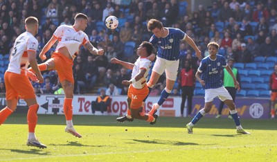 210326 - Cardiff City v Blackpool, EFL Sky Bet League 1 - Will Fish of Cardiff City and Reuell Walters of Blackpool compete for the ball infront of goal