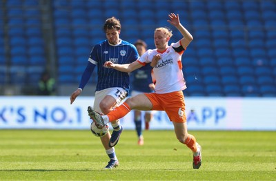 210326 - Cardiff City v Blackpool, EFL Sky Bet League 1 - Ollie Tanner of Cardiff City and Jordan Brown of Blackpool compete for the ball
