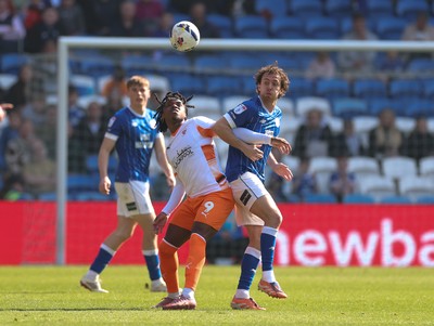 210326 - Cardiff City v Blackpool, EFL Sky Bet League 1 - Ryan Wintle of Cardiff City and Niall Ennis of Blackpool compete for the ball