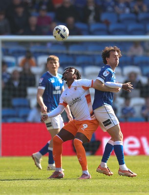 210326 - Cardiff City v Blackpool, EFL Sky Bet League 1 - Ryan Wintle of Cardiff City and Niall Ennis of Blackpool compete for the ball