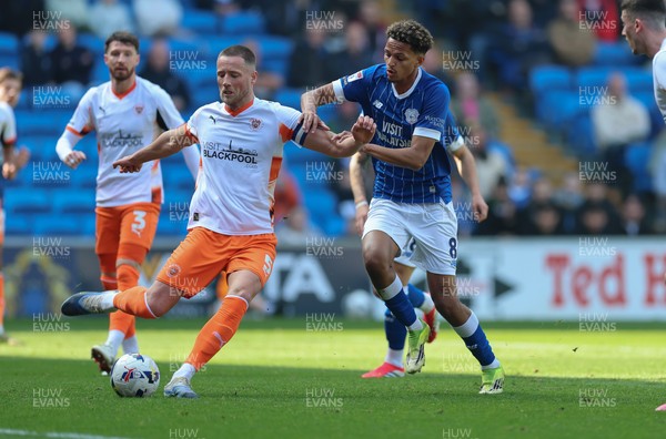 210326 - Cardiff City v Blackpool, EFL Sky Bet League 1 - Fraser Horsfall of Blackpool holds off Omari Kellyman of Cardiff City