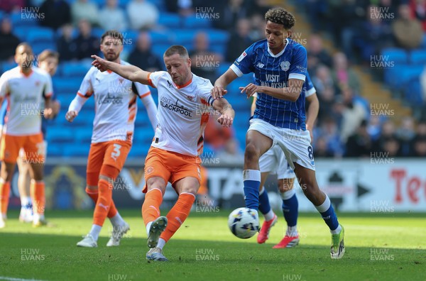 210326 - Cardiff City v Blackpool, EFL Sky Bet League 1 - Fraser Horsfall of Blackpool holds off Omari Kellyman of Cardiff City