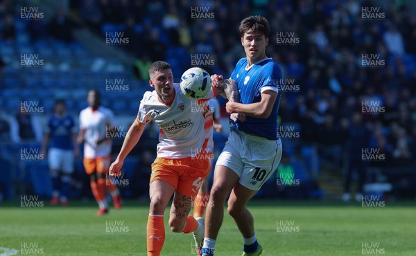 210326 - Cardiff City v Blackpool, EFL Sky Bet League 1 - Rubin Colwill of Cardiff City and Olly Casey of Blackpool compete for the ball