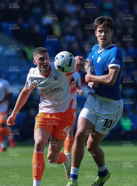 210326 - Cardiff City v Blackpool, EFL Sky Bet League 1 - Rubin Colwill of Cardiff City and Olly Casey of Blackpool compete for the ball