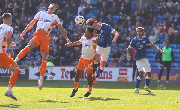 210326 - Cardiff City v Blackpool, EFL Sky Bet League 1 - Will Fish of Cardiff City and Reuell Walters of Blackpool compete for the ball infront of goal