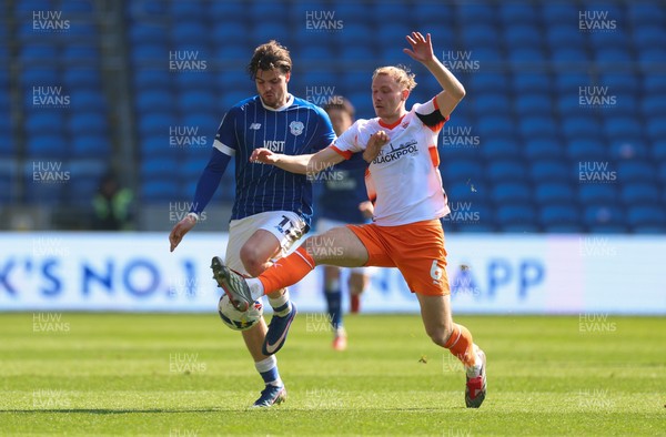 210326 - Cardiff City v Blackpool, EFL Sky Bet League 1 - Ollie Tanner of Cardiff City and Jordan Brown of Blackpool compete for the ball
